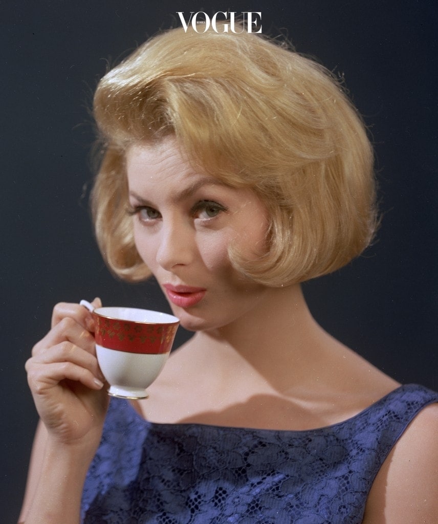 circa 1961: A well-groomed young woman quenching her thirst with a cup of strong coffee. (Photo by Chaloner Woods/Getty Images)